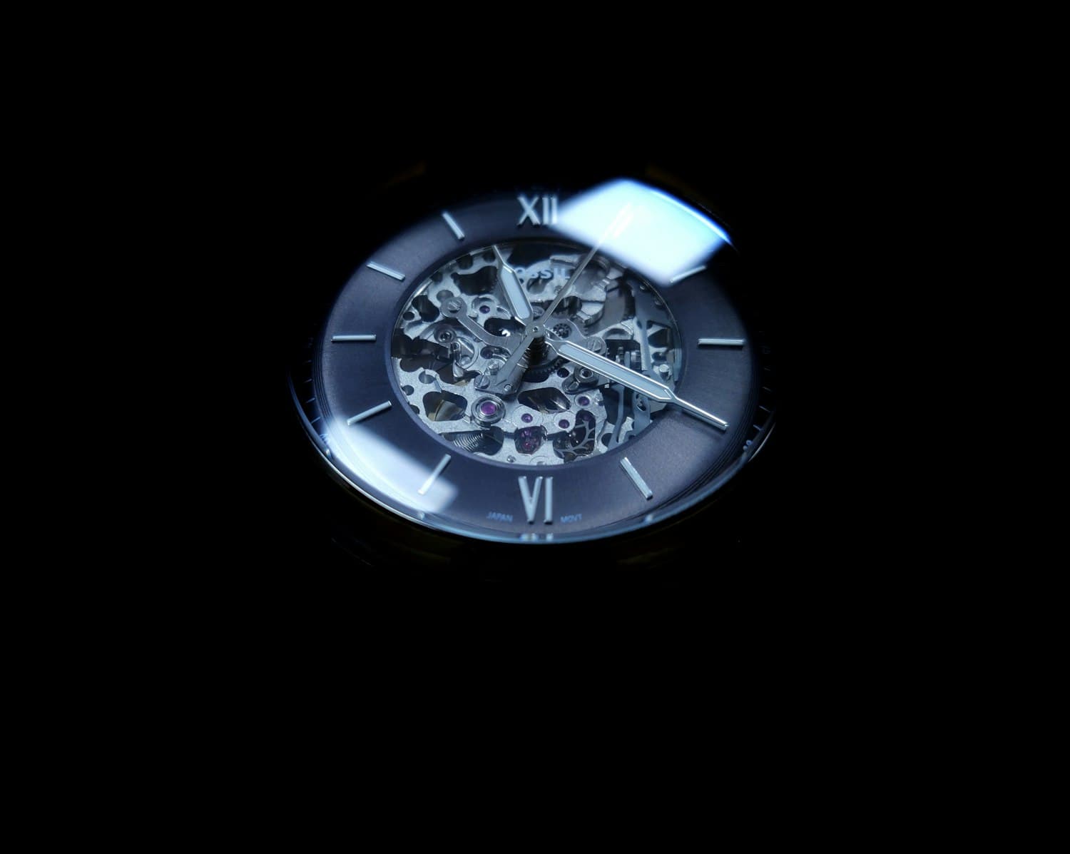 Openworked dress watch with a darkened skeleton dial