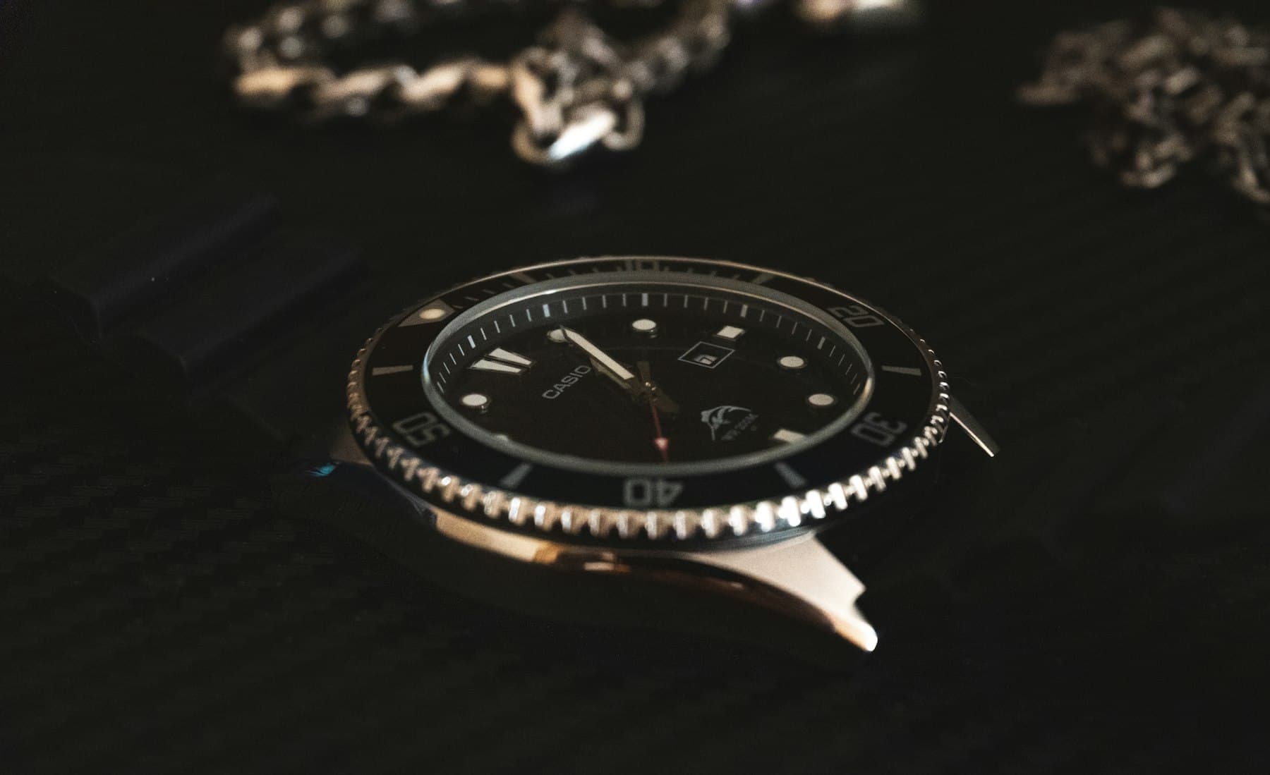 Dive watch on a black table