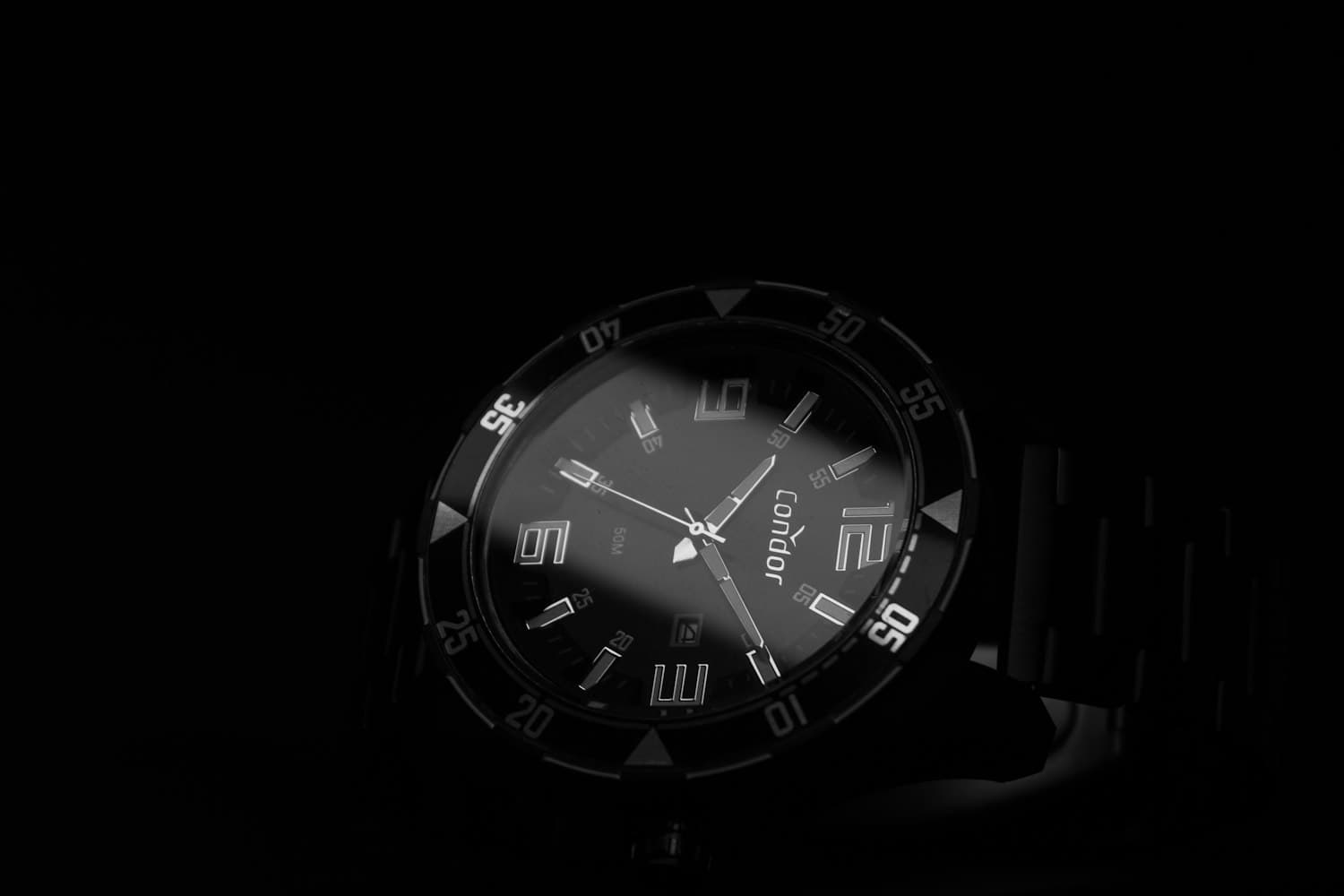 Matte black watch in near-darkness