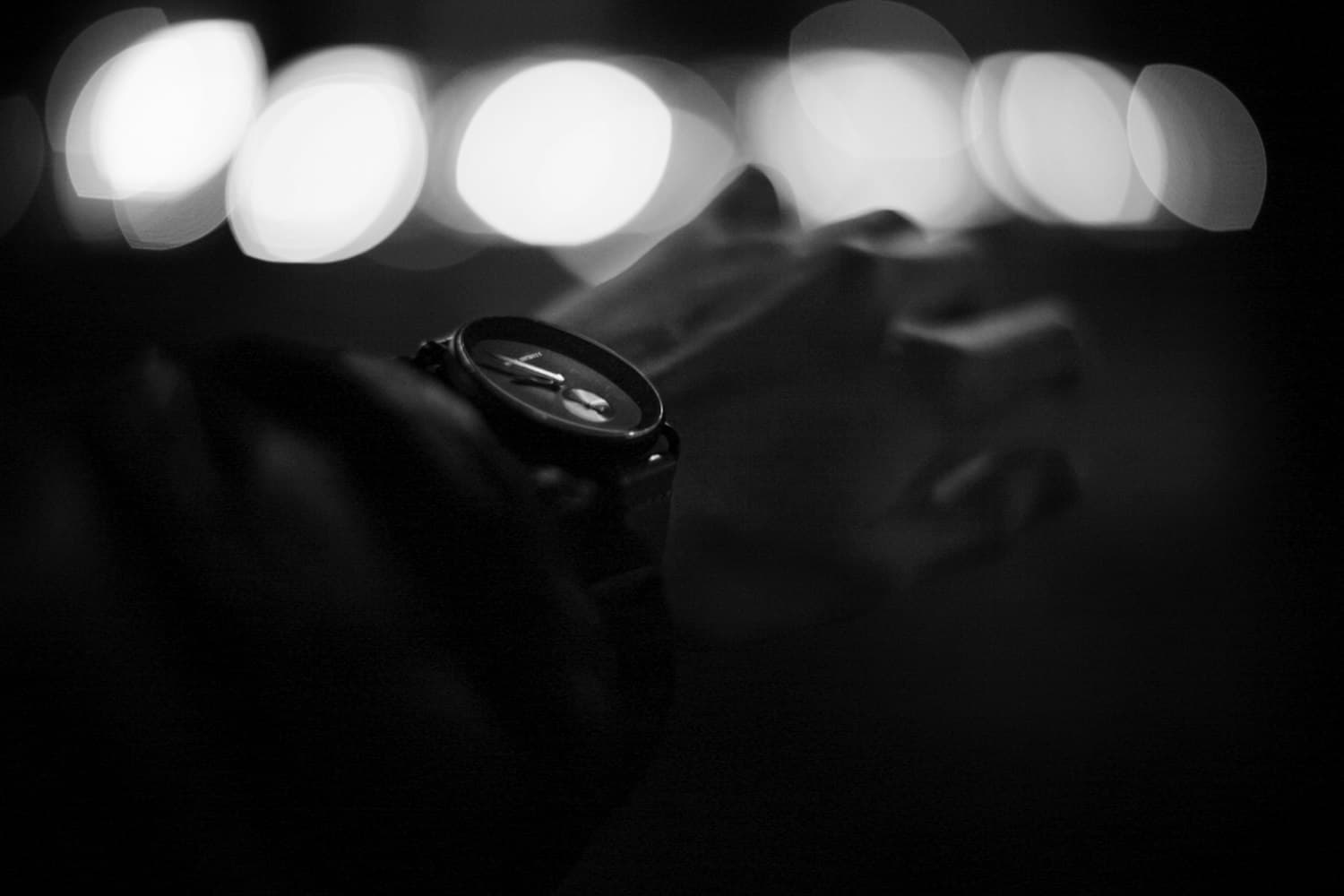 Black watch barely emerging from darkness